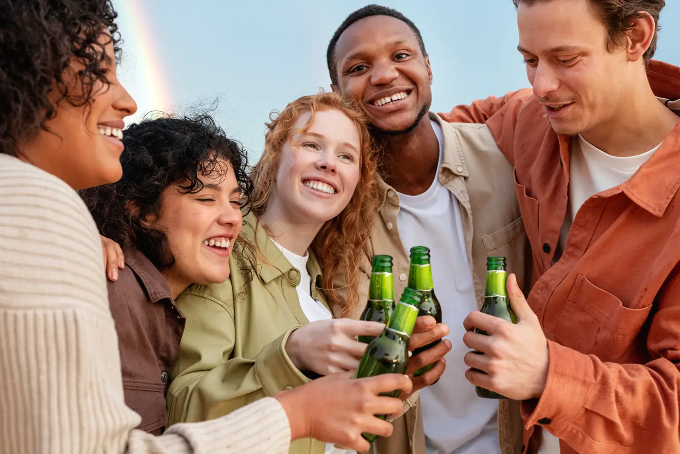 friends-smiling-drinking-beer-outdoor-party_new-scaled.png